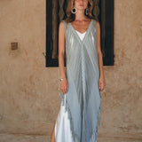Express your carefree and stylish vibe with this lightweight and sleeveless bohemian dress with its open "V" side cut!