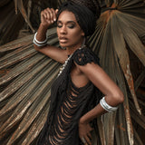 Get the boho look with this ladder-detailed black mini dress.