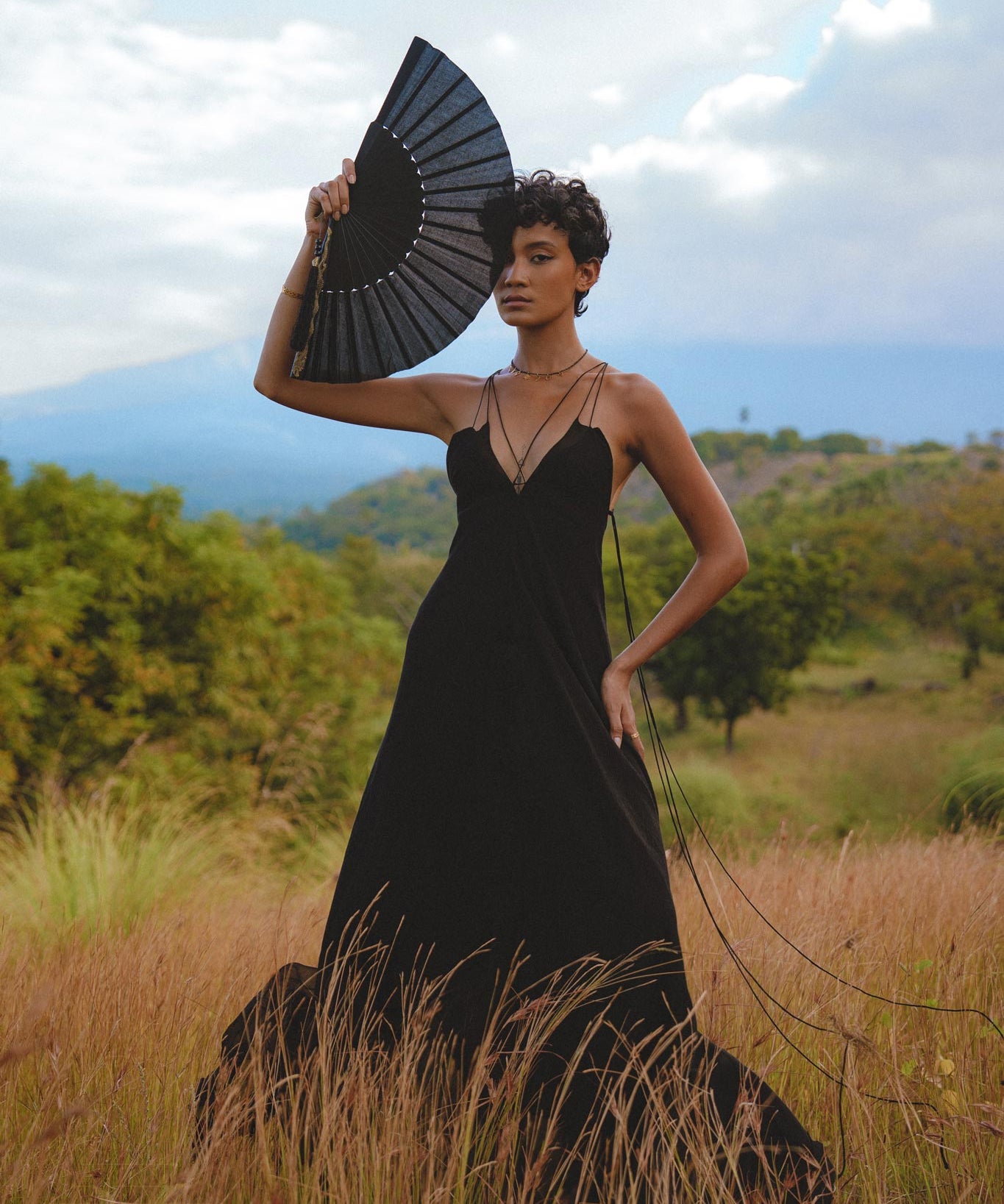 Embrace your inner goddess with this black boho dress, featuring a backless and minimalist design. Handcrafted with intricate lace details.