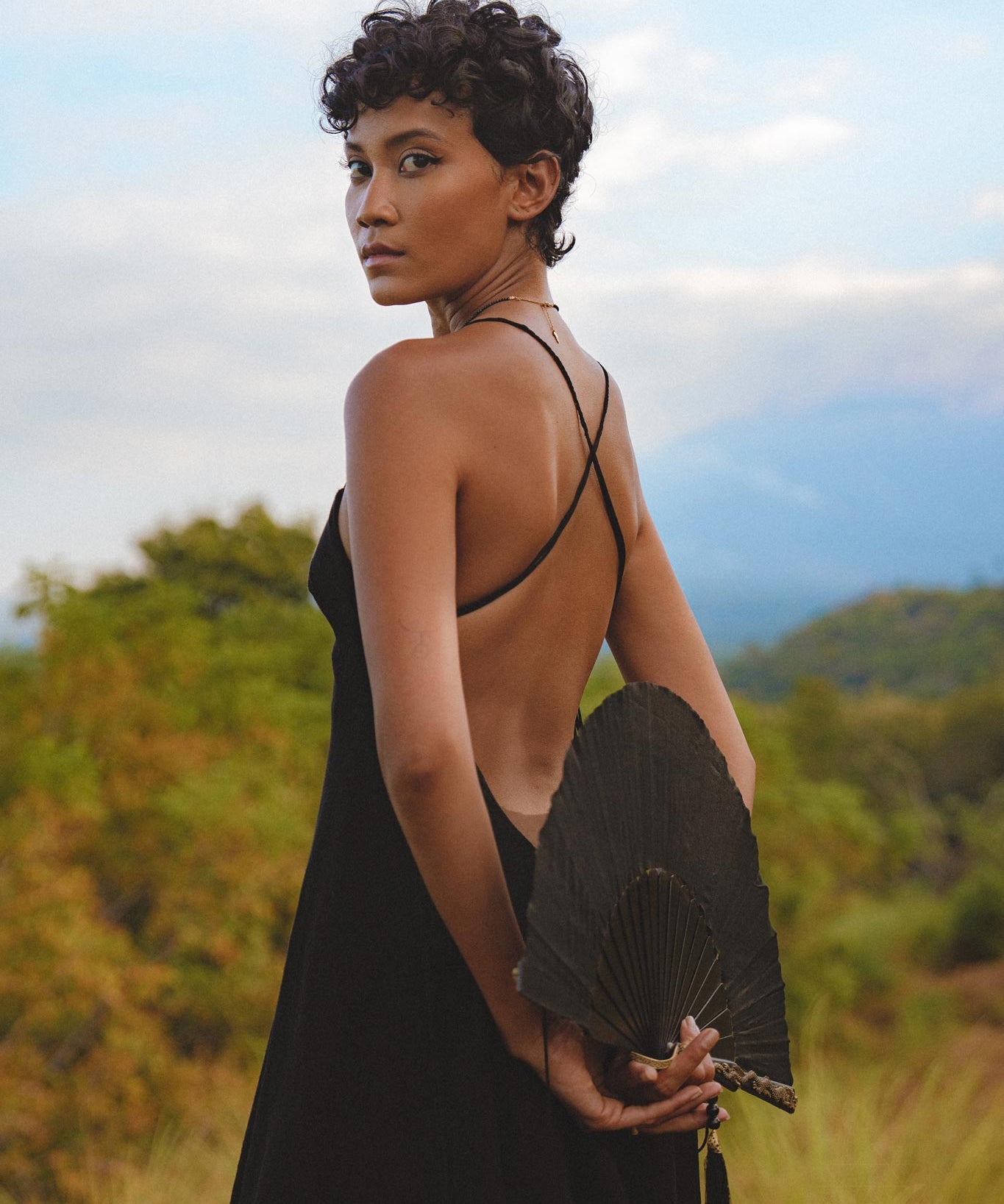 Channel your inner boho goddess with this black backless dress. A must-have for any minimalist lover, featuring handmade lace details.