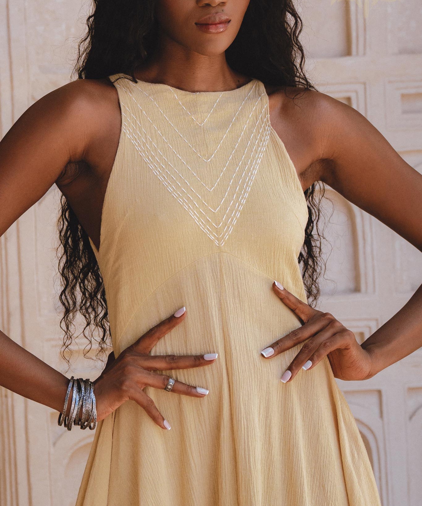 Hand-embroidered Gold Goddess Dress with small jingle bells, inspired by Indian culture. Lightweight, organic, and adorned with a unique ombré effect.