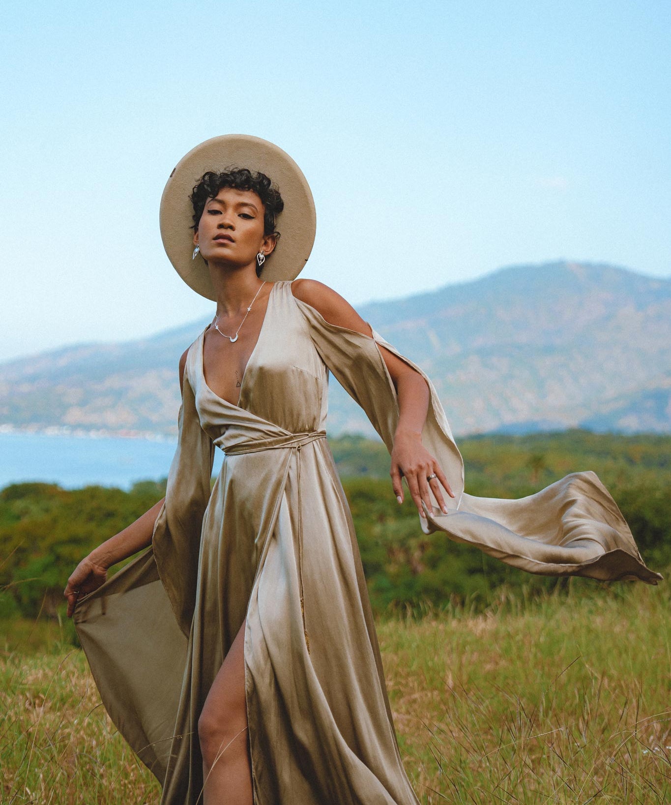 Luxurious silk dress in a light sage hue, perfect for weddings and special occasions. Effortlessly elegant and bohemian-inspired, with mesmerizing bell sleeves.