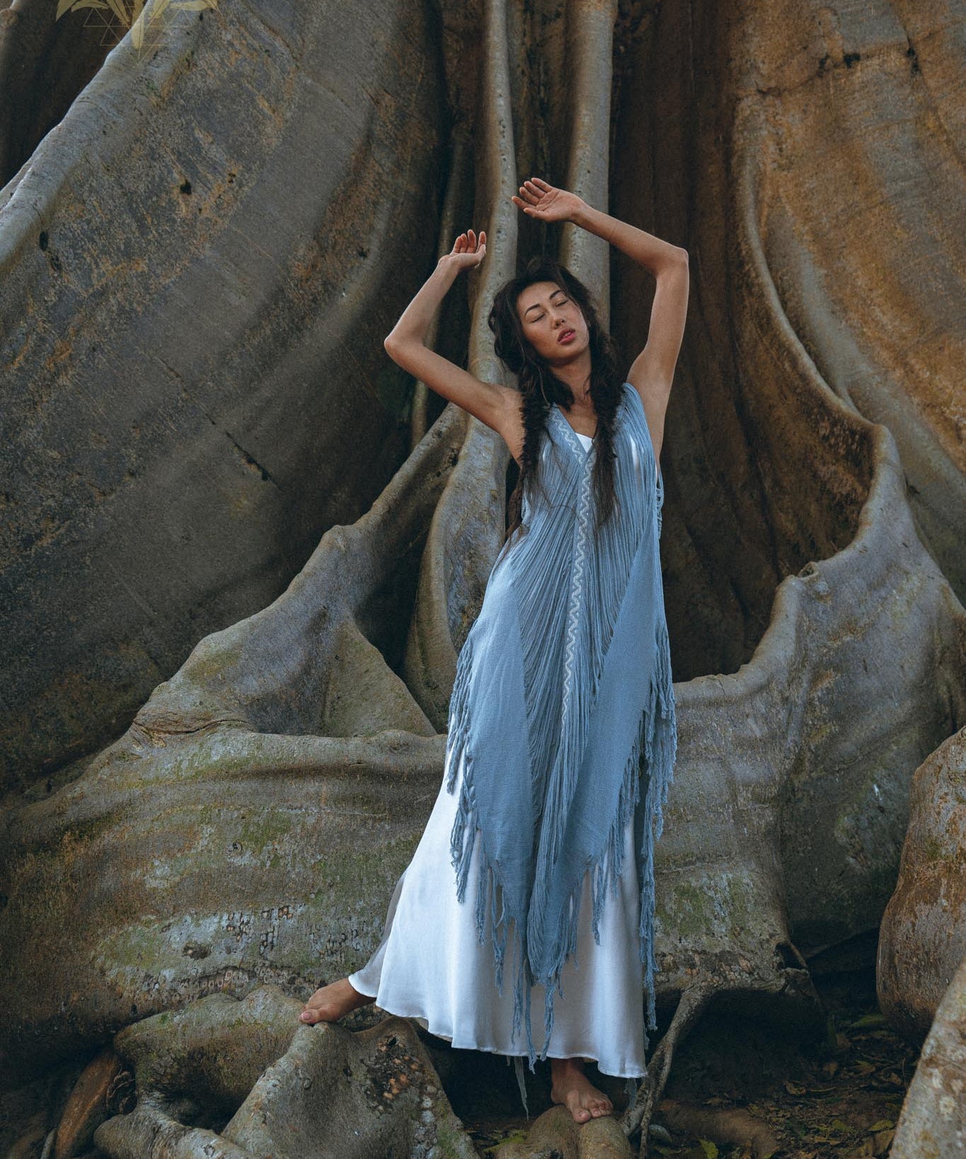 Look effortless and beautiful in this "Threads of Life" dress with its stunning deep blue hand-loomed layover and handmade embroidery.