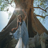 A timeless bohemian dress perfect for summer, featuring a hand-loomed layover and beautiful hand made embroidery.