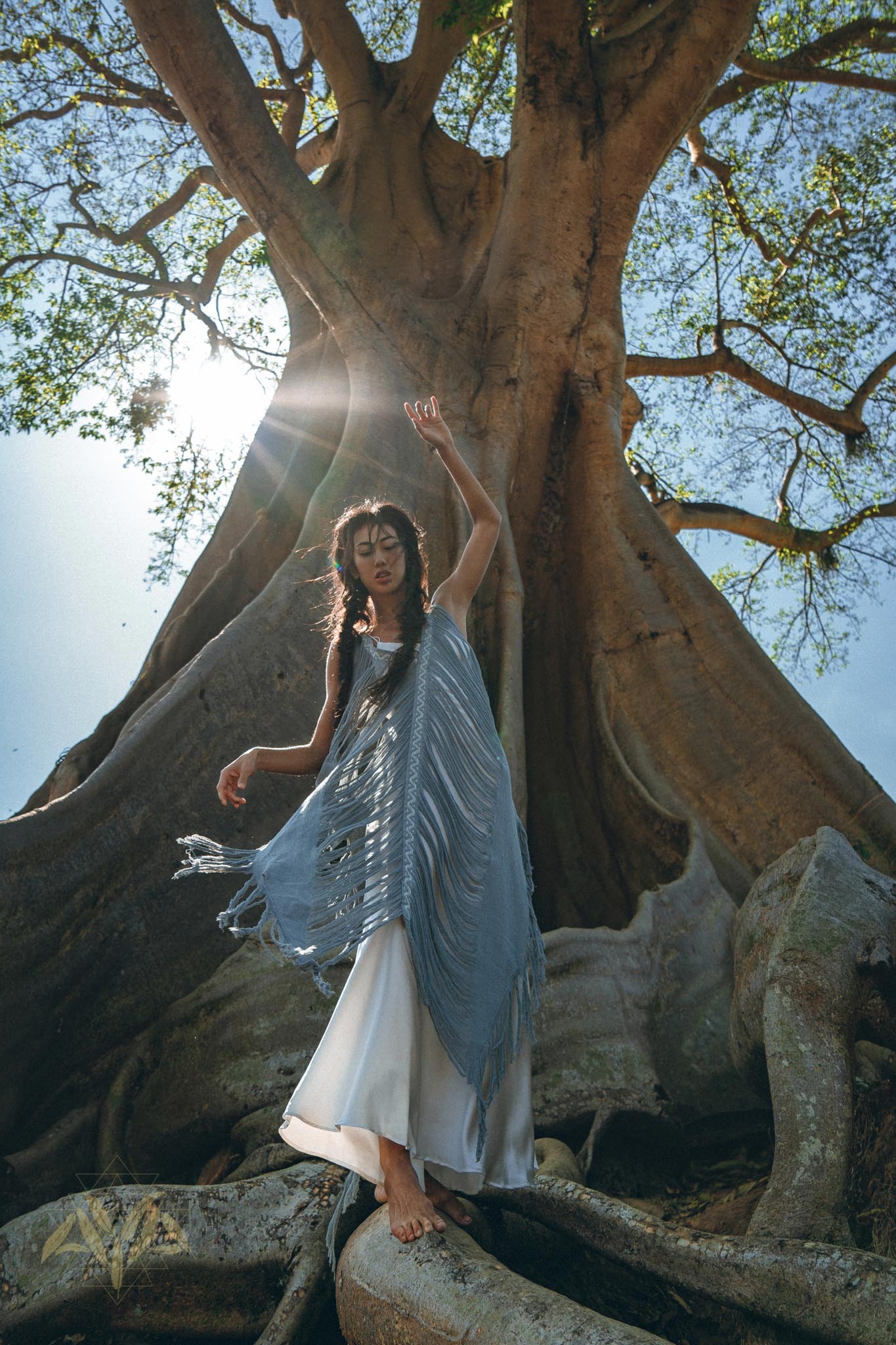 A timeless bohemian dress perfect for summer, featuring a hand-loomed layover and beautiful hand made embroidery.